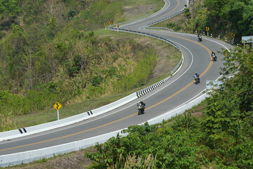 motorcycle on the road rides away. Travel on vacation, enjoy the nature trail. motorcycle in a sunny motorbike on the road riding.with sunset light. copyspace for your individual text..