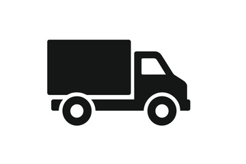 Delivery truck traveling on a city road during daytime in a bustling urban area