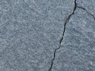 Obraz premium Smooth stone surface with single crack running diagonally Imperfection as beau