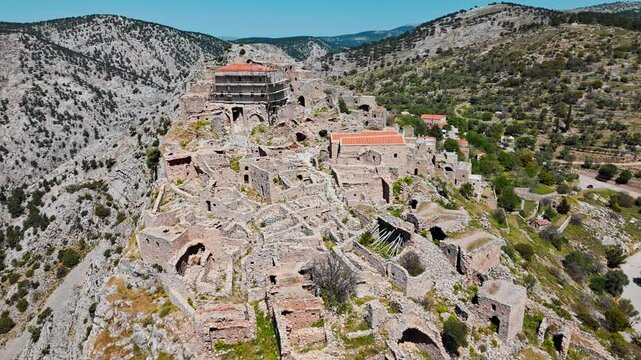 Abandoned Greek ghost town Anavatos with stone buildings on Chios island in Greece, Aerial view