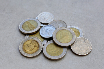 Banknotes with coins of the Thai baht money