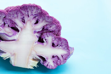 Purple cauliflower on blue background.