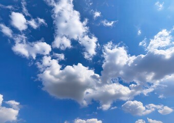 Obraz premium Fluffy clouds in a blue sky