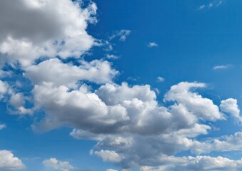 Fototapeta premium Fluffy clouds in a blue sky