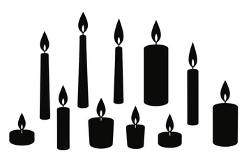 Collection of black candles with flames arranged in various heights on a white background