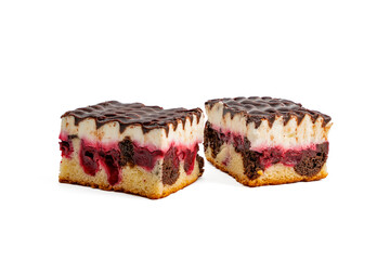 Two pieces of cake with chocolate-cherry filling. The cake is cut into squares. The cake is on a white background