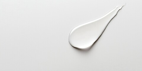 Smooth curved tear on plain white sheet