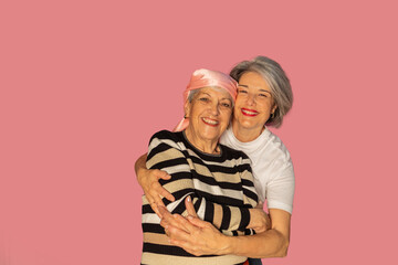 Daughter embracing and supporting mother fighting cancer with love and hope