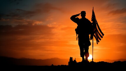 Silhouette of male soldier saluting american flag at sunset