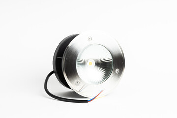 Compact Round LED Spotlight with Exposed Wires Isolated on White Background

