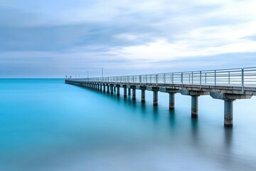 Fototapeta premium Exploring the serene beauty of Rapid Bay Jetty at dusk in South Australia, Iconic landmark of South Australia Rapid Bay Jetty pier and blue ocean water