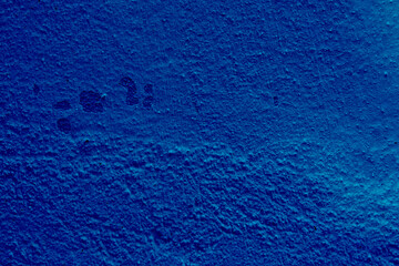 Vivid blue textured wall close-up
