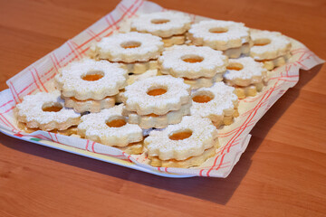 Homemade linzer cookies with powdered sugar
