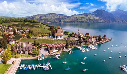 Gordijnen Canton Bern in Switzerland. aerial drone panorama of lake Thun and the Spiez village with medieval castle and old town. © Freesurf