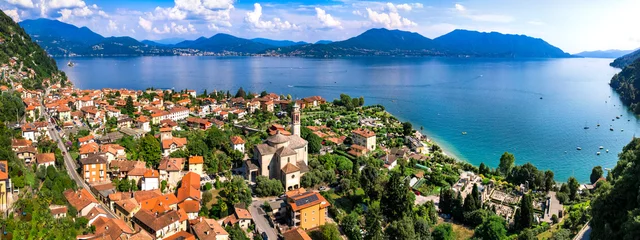 Gordijnen Italy, Piedmot region (Piemonte) beautiful Lake Lago Maggiore. scenic village Cassino in Cannero Riviera , border with Switzerland. Aerial panoramic view of lakeside town and mountains © Freesurf