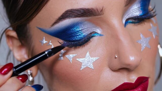 Vibrant blue eye makeup with star design and precise eyeliner application closeup