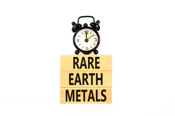 Rare earth metals symbol. Concept words Rare earth metals on beautiful wooden block. Black alarm...