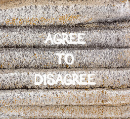 Agree to disagree symbol. Concept words Agree to disagree on beautiful grey stone wall. Beautiful...