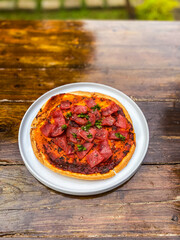 Close-up of delicious salsa served in a white bowl, highlighting its vibrant colors and fresh taste.
