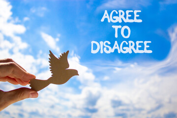 Agree to disagree symbol. Concept words Agree to disagree. Beautiful blue sky clouds background....