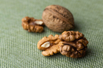 Walnuts close-up on table with green tablecloth