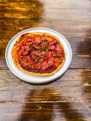 A beautifully plated salsa served with crispy tortilla chips for perfect dipping; ideal for sharing at gatherings.
