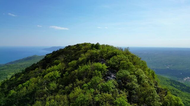 Aerial view of Sisol peak near Brseč, offering stunning views of Učka(Ucka) Nature Park, the Adriatic Sea, and Rijeka city. A beautiful hiking destination on the eastern coast of Istria, Croatia