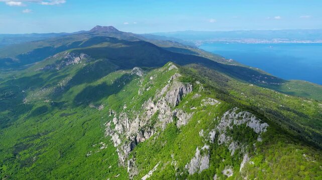 Aerial view of Sisol peak near Brseč, offering stunning views of Učka(Ucka) Nature Park, the Adriatic Sea, and Rijeka city. A beautiful hiking destination on the eastern coast of Istria, Croatia