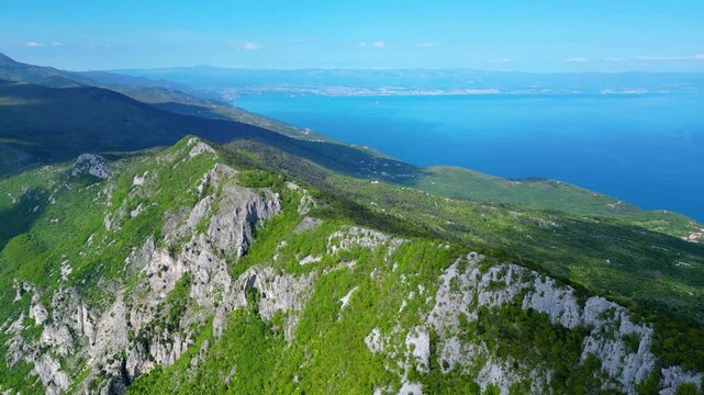 Aerial view of Sisol peak near Brseč, offering stunning views of Učka(Ucka) Nature Park, the Adriatic Sea, and Rijeka city. A beautiful hiking destination on the eastern coast of Istria, Croatia