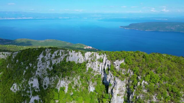Aerial view of Sisol peak near Brseč, offering stunning views of Učka(Ucka) Nature Park, the Adriatic Sea, and Rijeka city. A beautiful hiking destination on the eastern coast of Istria, Croatia