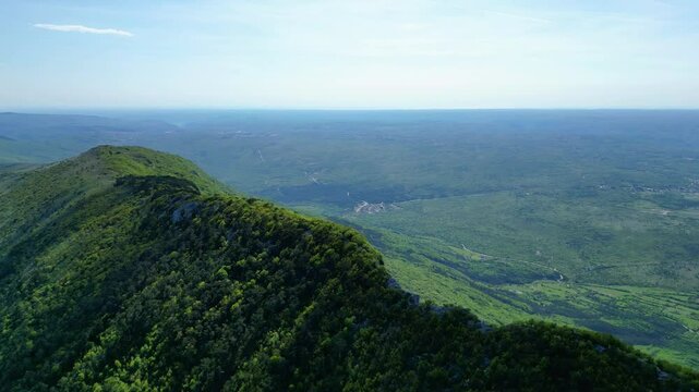 Aerial view of Sisol peak near Brseč, offering stunning views of Učka(Ucka) Nature Park, the Adriatic Sea, and Rijeka city. A beautiful hiking destination on the eastern coast of Istria, Croatia