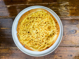 An appealing dish of pasta, served in a rustic bowl with fresh herbs, perfect for a cozy meal.