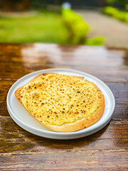 An engaging presentation of pasta served on a rustic wooden table, perfect for casual dining.