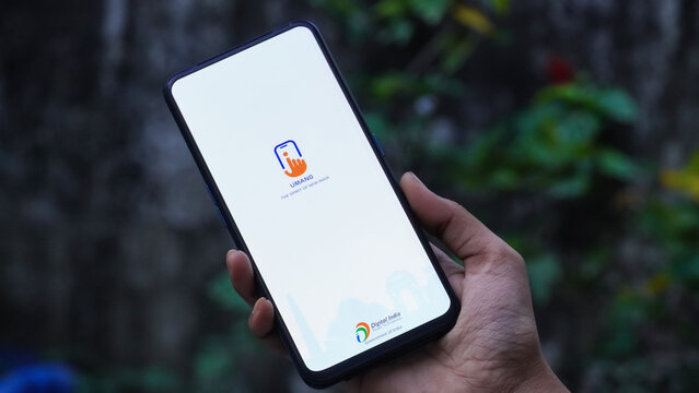 INDIA, DELHI - JANUARY 25, 2025: Hand Holding Smartphone Displaying Umang App for Digital Services in India