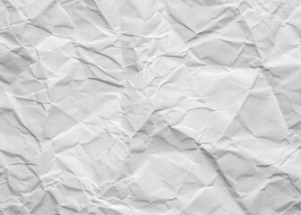 Obraz premium Crumpled white paper texture on a clean, blank surface, featuring wrinkles against a white background.
