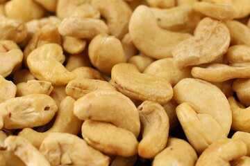 Cashew nuts arranged in a closeup display showcasing their natural color and texture