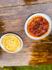 A beautifully plated dish featuring pasta and fresh salsa, ideal for sharing with friends or family during gatherings.