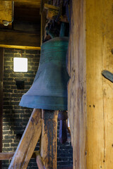 Historic church bells inside medieval tower in Toruń Old Town, Poland..