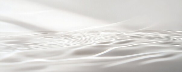 Obraz premium Smooth, white fabric with soft folds and light.
