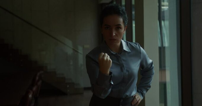 Young dissatisfied irritable angry woman 30 years old waving fist at camera, index finger waving at screen, argument with person, conflict situation, lifestyle concept of people in anger