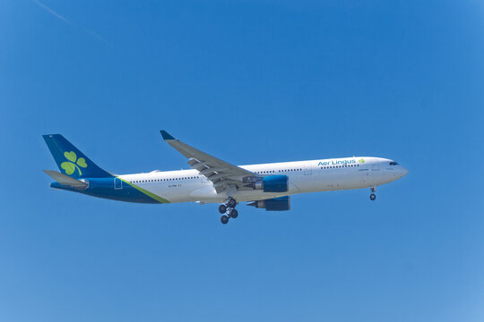Faro, Portugal - april 16, 2025 : sign and logo on an airplane of Aer Lingus airline landing at Faro airport
