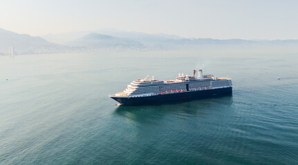 Aerial view of huge cruise ship arriving at puerto vallarta in the morning, mexico