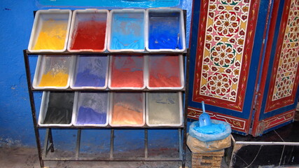 Trays of powdered dye in front of a shop in Chefchaouen, Morocco