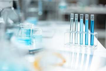Chemical laboratory glassware with blue liquid samples in test tubes, scientific research experiment, biotechnology innovation, pharmaceutical analysis development, medical diagnostics