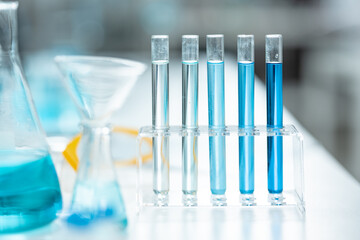 Chemical laboratory glassware with blue liquid samples in test tubes, scientific research experiment, biotechnology innovation, pharmaceutical analysis development, medical diagnostics