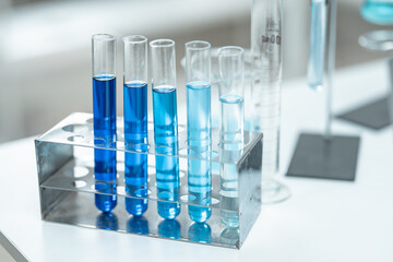 Chemical laboratory glassware with blue liquid samples in test tubes, scientific research experiment, biotechnology innovation, pharmaceutical analysis development, medical diagnostics
