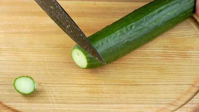 Very satisfying and relaxing cucumber ASMR video. Cutting anti-stress macro close-up colorful cucumber with a knife. ASMR sounds.