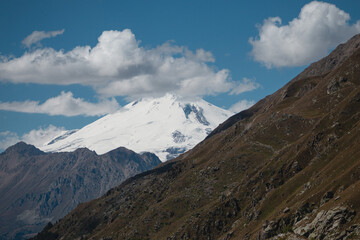 Snowy mountain peak under blue sky