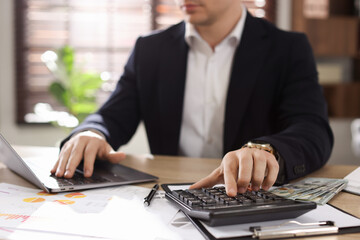 Professional banker working at desk in office, closeup