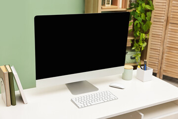 Comfortable workplace with modern computer and stationery on white table indoors